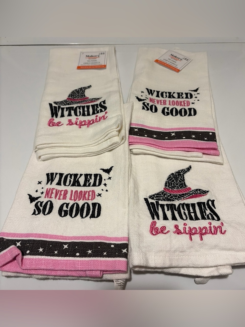 Four Halloween witch tea towels